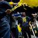 Michigan junior Jordan Morgan walks down an aisle and receives congratulations from fans at Crisler Arena on Tuesday, April 9. AnnArbor.com I Daniel Brenner